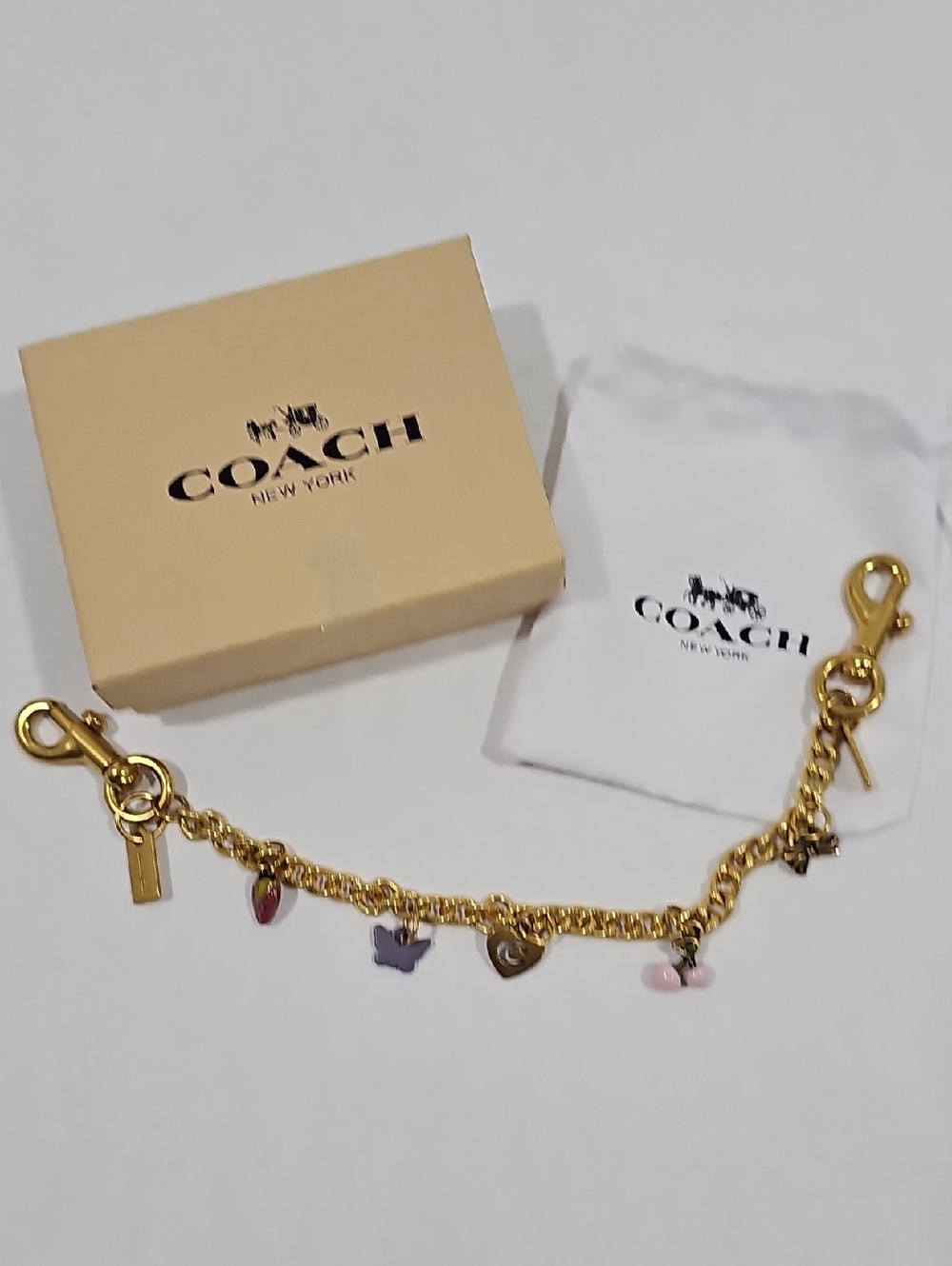 Coach Gold Tone Charm Bracelet with Pink & Purple Accents #28